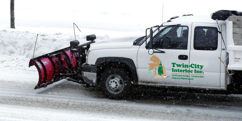 Twin City Interloc truck clearing snow and salting