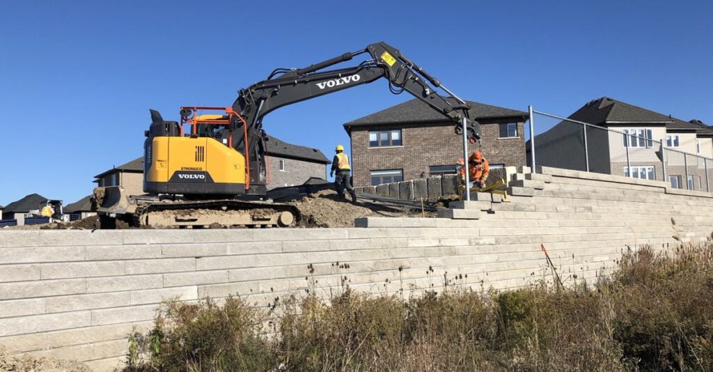 Corner of Precast retaining wall with fence