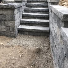 Precast retaining wall with steps