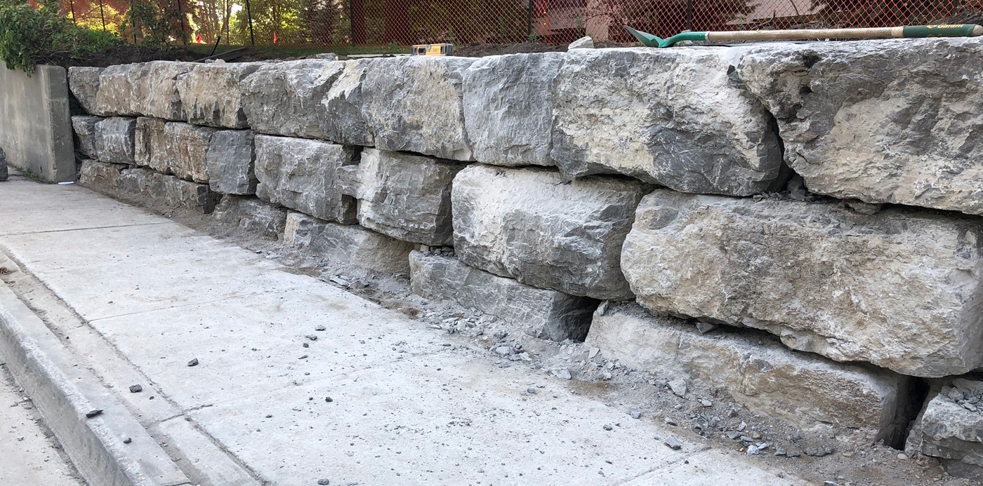 construction of large stone retaining wall